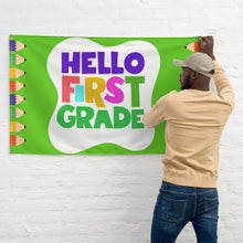 Load image into Gallery viewer, HELLO FIRST GRADE Flag For Teachers Classroom | 61&quot; x 38&quot; | Front View Lifestyle Photo | Shop The Wishful Fish
