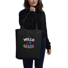 Load image into Gallery viewer, HELLO FOURTH GRADE Eco Tote Bag For Teachers | Front View Lifestyle | Black | Shop The Wishful Fish
