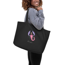 Load image into Gallery viewer, Zodiac Scorpio Large Organic Cotton Tote Bag | Front and Back View Lifestyle Photo | The Wishful Fish
