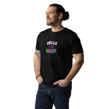 Load image into Gallery viewer, HELLO FOURTH GRADE Unisex Organic Cotton T Shirt For Teachers | Black | Front View Lifestyle of Male Teacher | Shop The Wishful Fish
